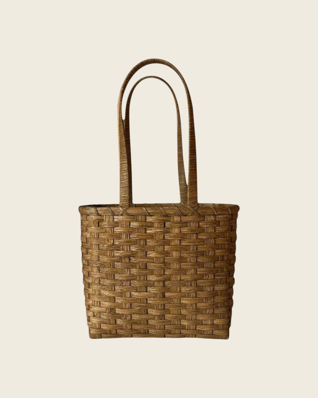 Weldun Carol Lunch Basket hand-woven from natural brown rattan with long shoulder straps for hands-free carrying.