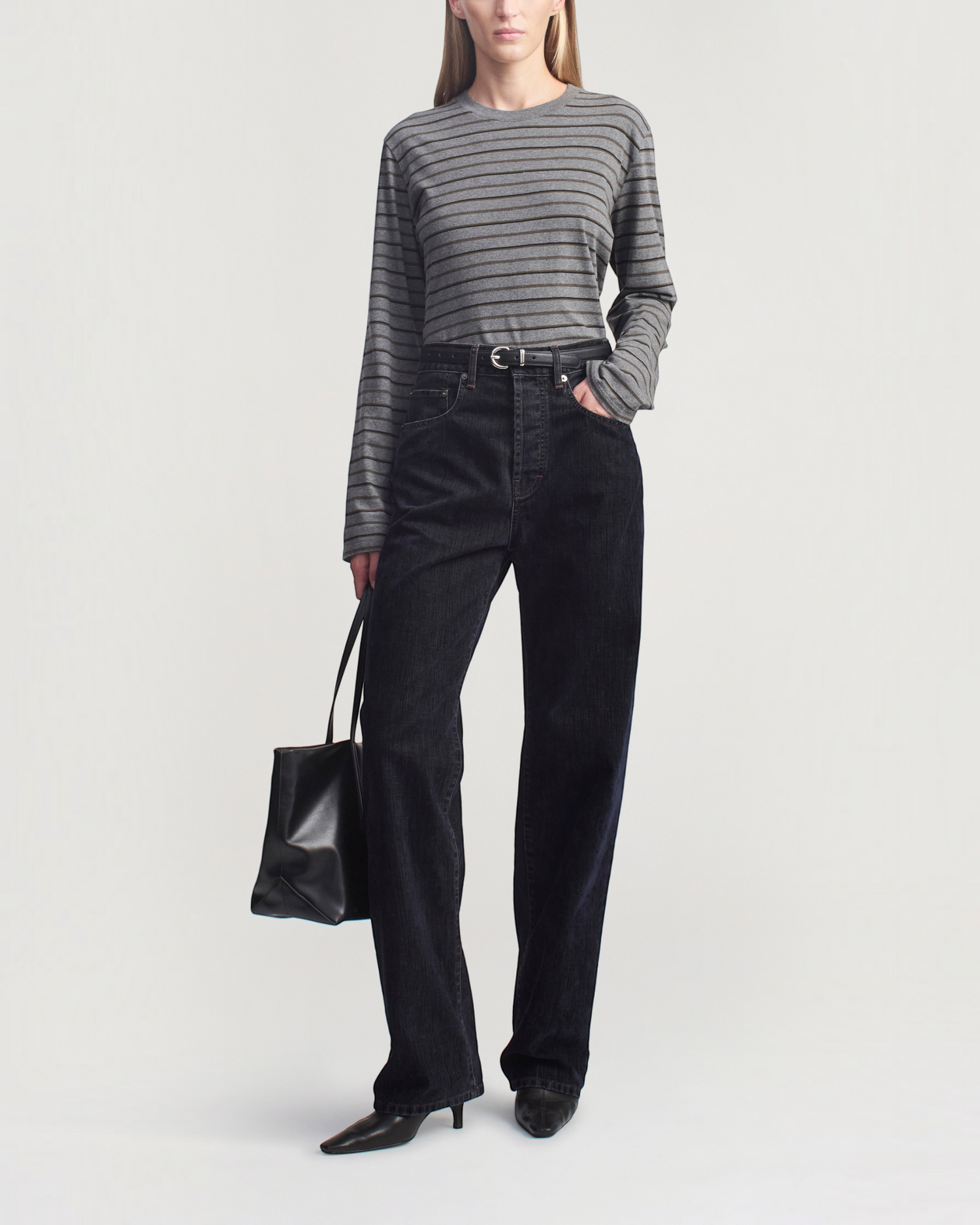 Weldun Wynn long sleeve charcoal striped cotton t-shirt with a relaxed boxy fit worn by a model in dark denim jeans.