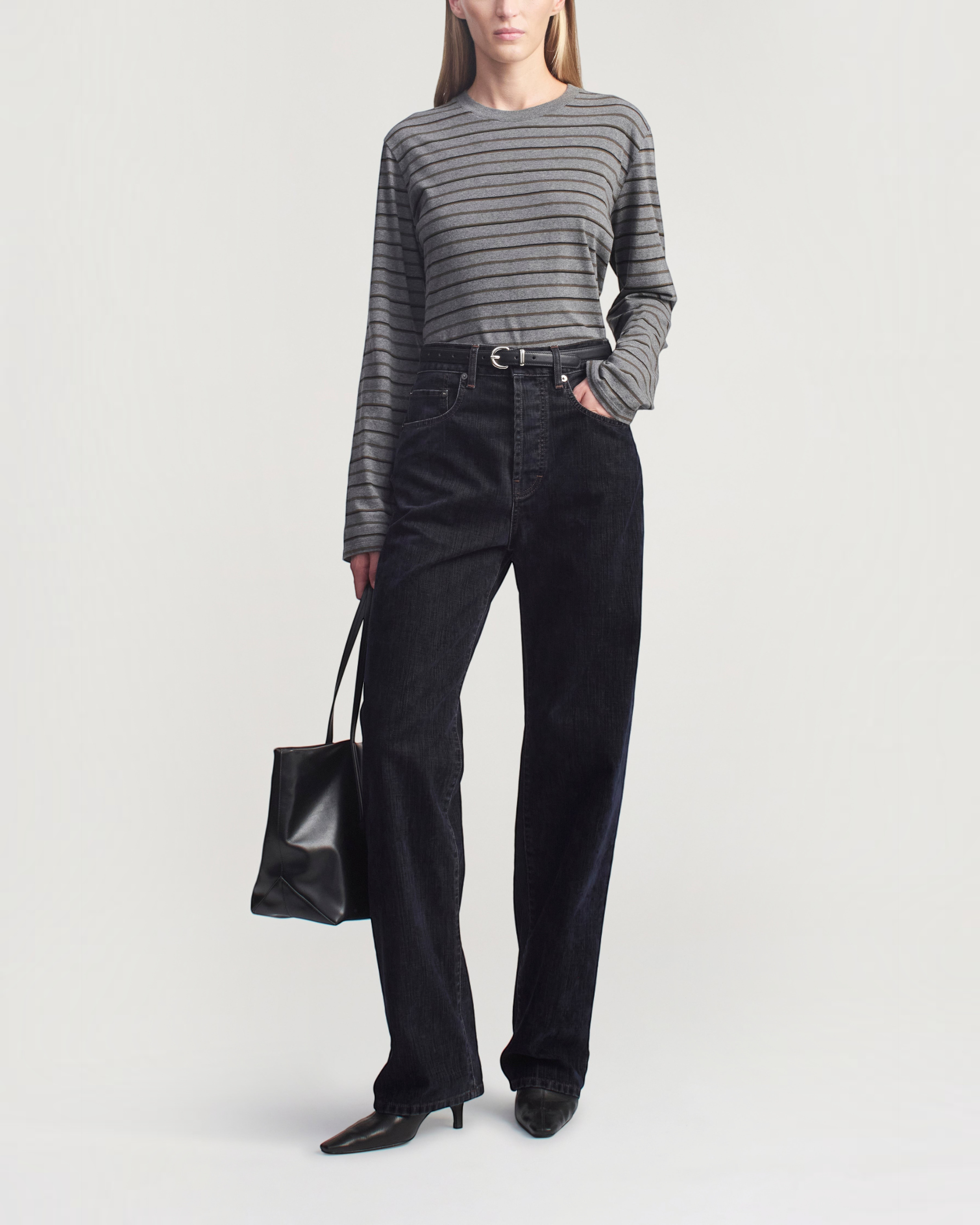 Weldun Wynn long sleeve charcoal striped cotton t-shirt with a relaxed boxy fit worn by a model in dark denim jeans.